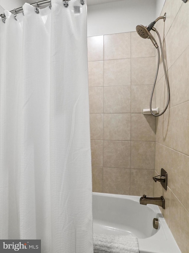 full bath featuring shower / bathtub combination with curtain