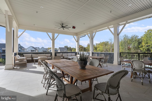 view of patio / terrace featuring outdoor dining area, outdoor lounge area, and a ceiling fan