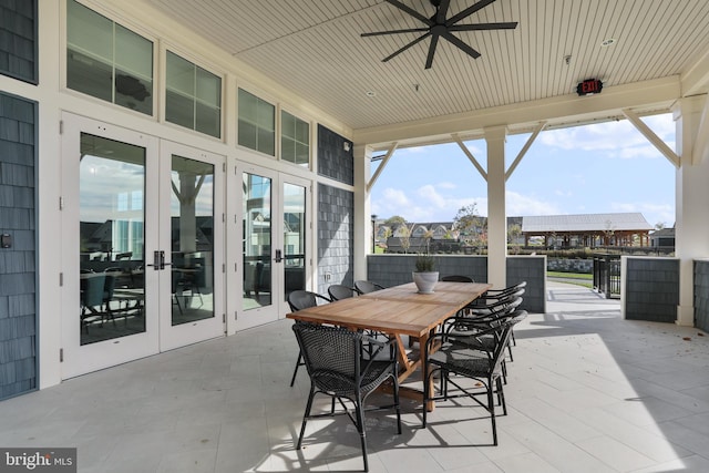 view of patio / terrace featuring ceiling fan, french doors, and outdoor dining area