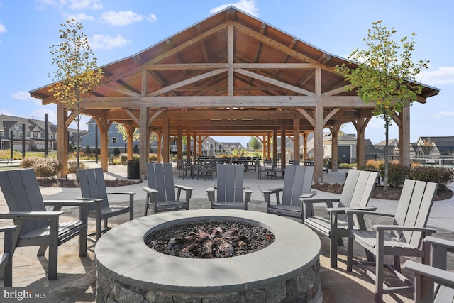 view of patio / terrace with a fire pit and a gazebo