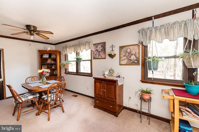 dining space with light carpet, visible vents, ornamental molding, and a textured ceiling