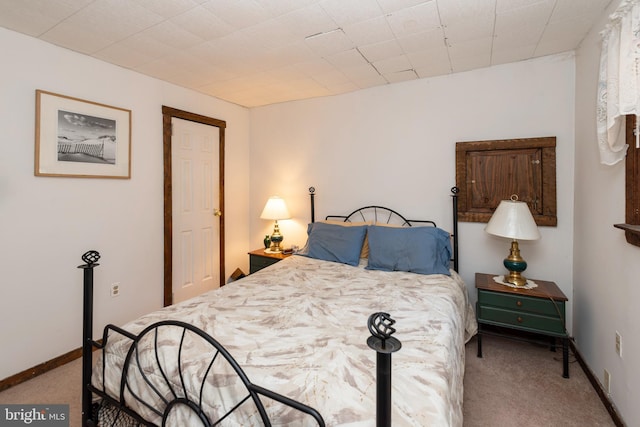 bedroom featuring carpet floors and baseboards