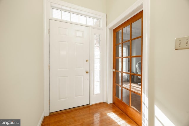 foyer entrance with light wood-style floors