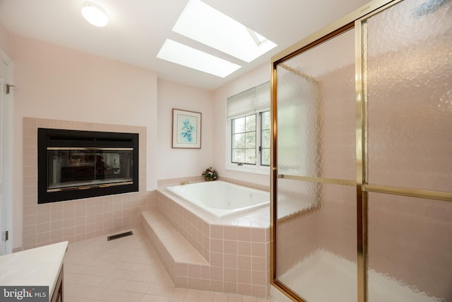 full bathroom with visible vents, a shower stall, a bath, and tile patterned floors