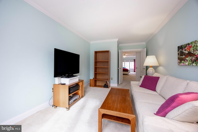 living area featuring baseboards, crown molding, and light colored carpet