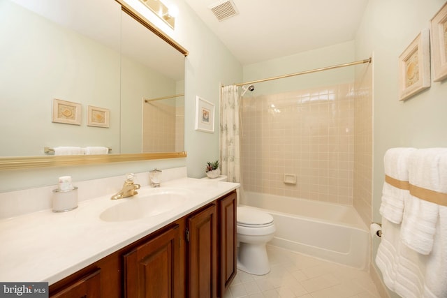 bathroom featuring toilet, shower / tub combo, vanity, visible vents, and tile patterned floors