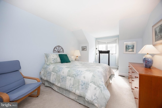 bedroom featuring carpet and baseboards