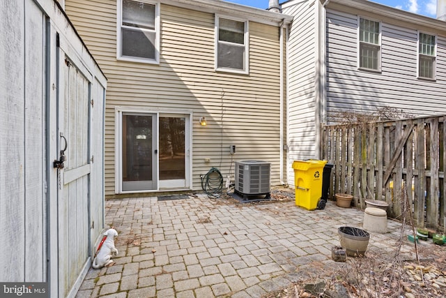 view of patio featuring fence and central AC unit