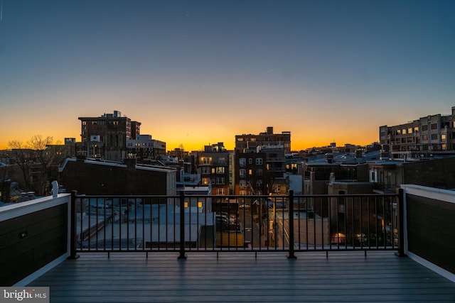 wooden deck with a city view