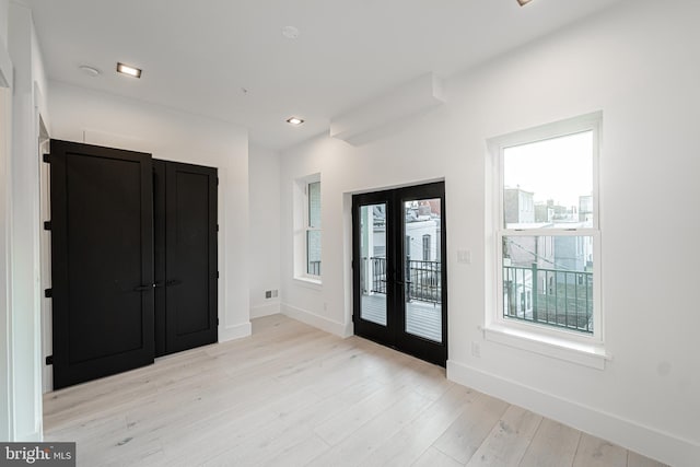 entryway with recessed lighting, visible vents, baseboards, french doors, and light wood-type flooring