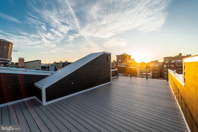 wooden deck with a city view