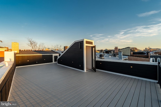 wooden deck with a city view