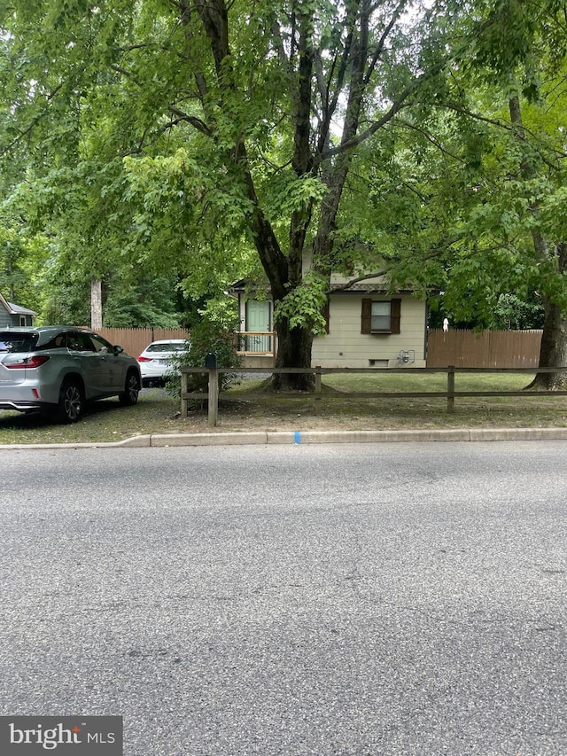 obstructed view of property featuring fence