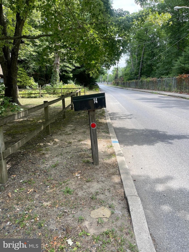 view of road with curbs