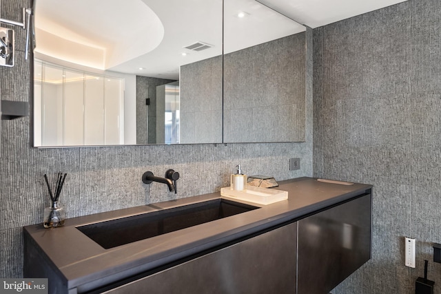 2510 Virginia Ave NW Unit 512-S, Washington, DC 20037 - bathroom featuring vanity, tasteful backsplash, and tile walls
