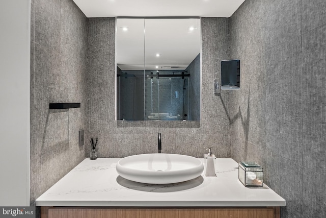 2510 Virginia Ave NW Unit 512-S, Washington, DC 20037 - full bath with tile walls, vanity, a shower stall, and tasteful backsplash