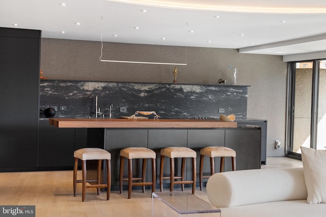 2510 Virginia Ave NW Unit 512-S, Washington, DC 20037 - indoor wet bar with light wood finished floors and recessed lighting