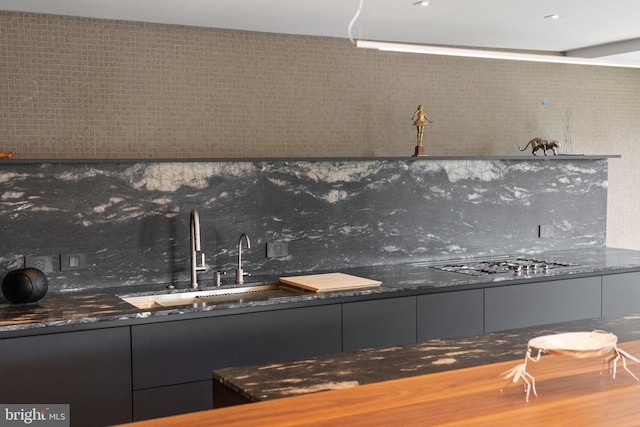 2510 Virginia Ave NW Unit 512-S, Washington, DC 20037 - kitchen featuring stainless steel gas stovetop, dark countertops, and backsplash
