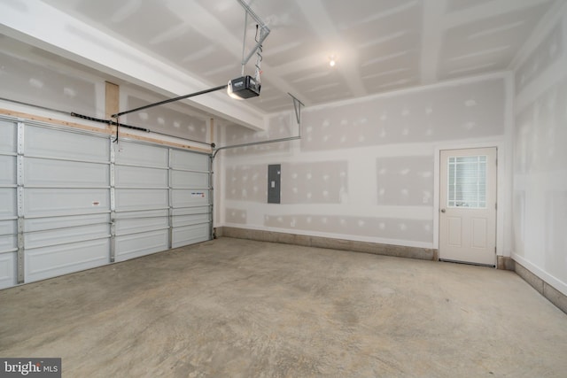 garage with electric panel and a garage door opener