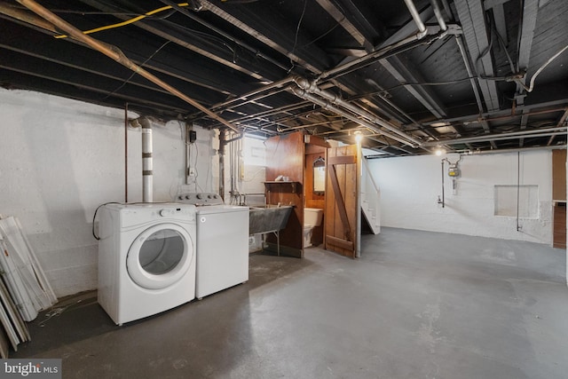 unfinished basement with washer and dryer