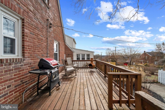 wooden deck with area for grilling