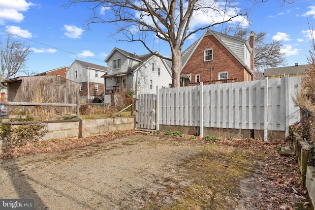 exterior space with a residential view and fence