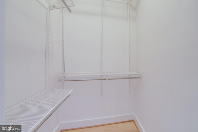 spacious closet with light wood-style floors