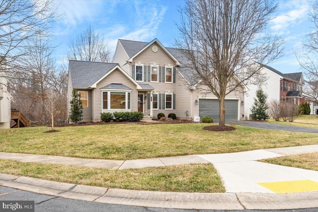 traditional home with driveway, a front lawn, and roof with shingles