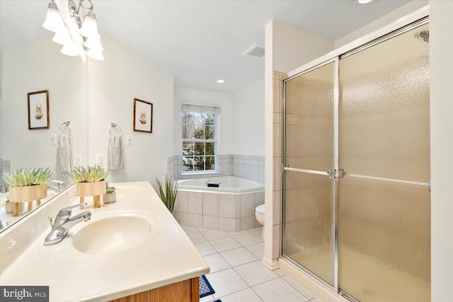 bathroom with visible vents, a sink, tile patterned flooring, a shower stall, and a bath