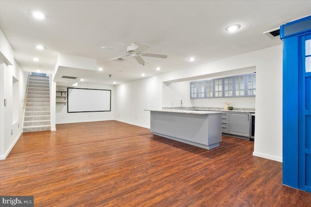 kitchen with glass insert cabinets, recessed lighting, and dark wood-style floors