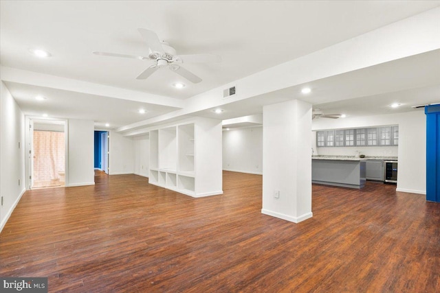 below grade area featuring ceiling fan, wine cooler, recessed lighting, dark wood-style flooring, and visible vents