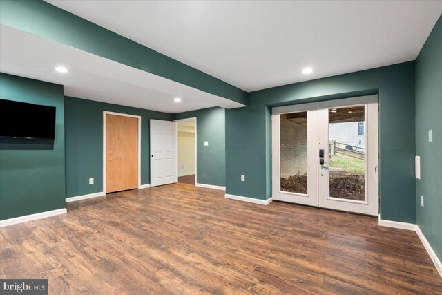 interior space featuring recessed lighting, french doors, baseboards, and wood finished floors