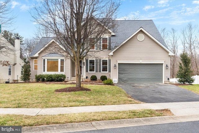 view of front of house with aphalt driveway, a front lawn, an attached garage, and roof with shingles