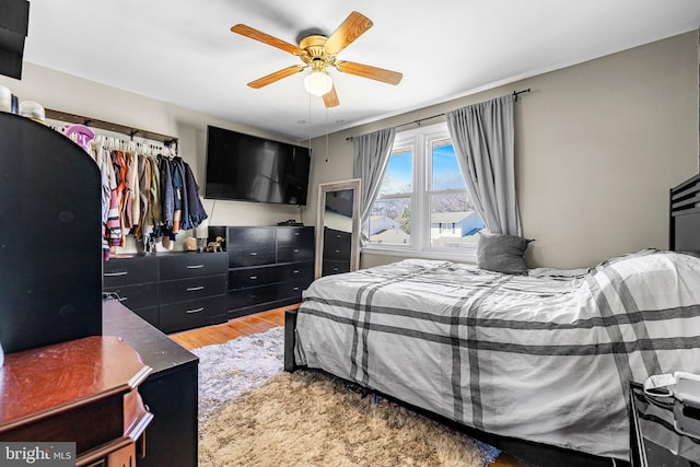 bedroom featuring ceiling fan and light wood finished floors