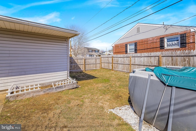 view of yard with a fenced backyard