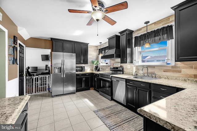 kitchen with custom exhaust hood, stainless steel appliances, hanging light fixtures, a sink, and dark cabinetry