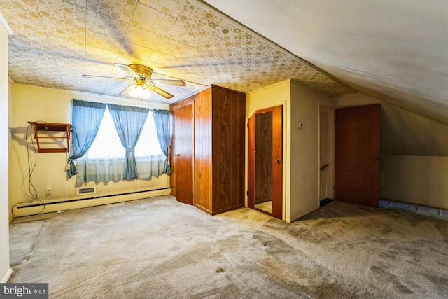 bonus room featuring carpet, ceiling fan, lofted ceiling, and a baseboard radiator