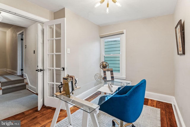 office area featuring wood finished floors and baseboards