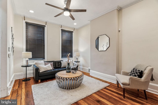 living area featuring ornamental molding, recessed lighting, baseboards, and wood finished floors