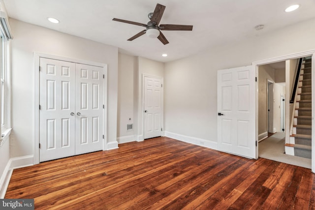 unfurnished bedroom featuring baseboards, ceiling fan, wood finished floors, and recessed lighting