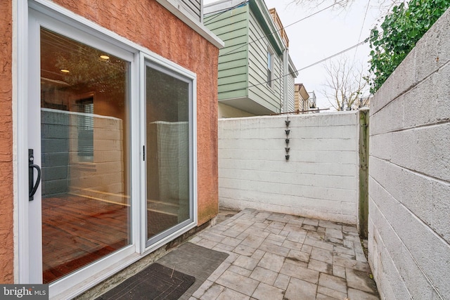 view of patio / terrace featuring fence