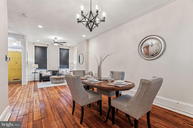 dining space with baseboards, recessed lighting, hardwood / wood-style flooring, and crown molding