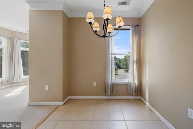 unfurnished dining area featuring ornamental molding, tile patterned flooring, visible vents, and an inviting chandelier