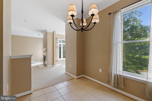 unfurnished dining area featuring light carpet, light tile patterned floors, a warm lit fireplace, and crown molding