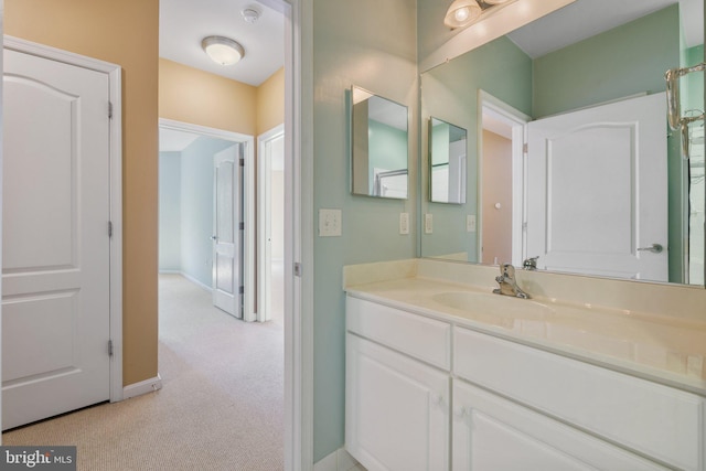 bathroom with vanity and baseboards