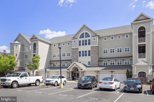 view of building exterior featuring uncovered parking