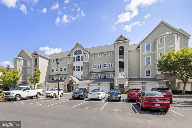 view of building exterior with uncovered parking