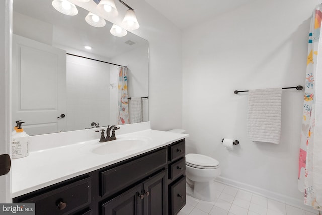 bathroom with tile patterned flooring, toilet, visible vents, vanity, and baseboards