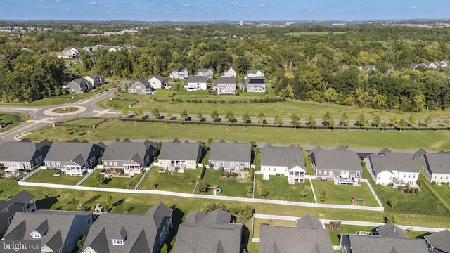 birds eye view of property with a residential view and a view of trees