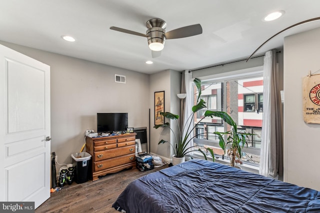 bedroom featuring access to outside, visible vents, wood finished floors, and recessed lighting